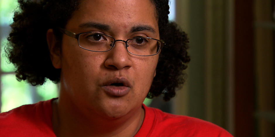 Biracial black woman, Jennifer Msumba, speaking in interview with CBS.